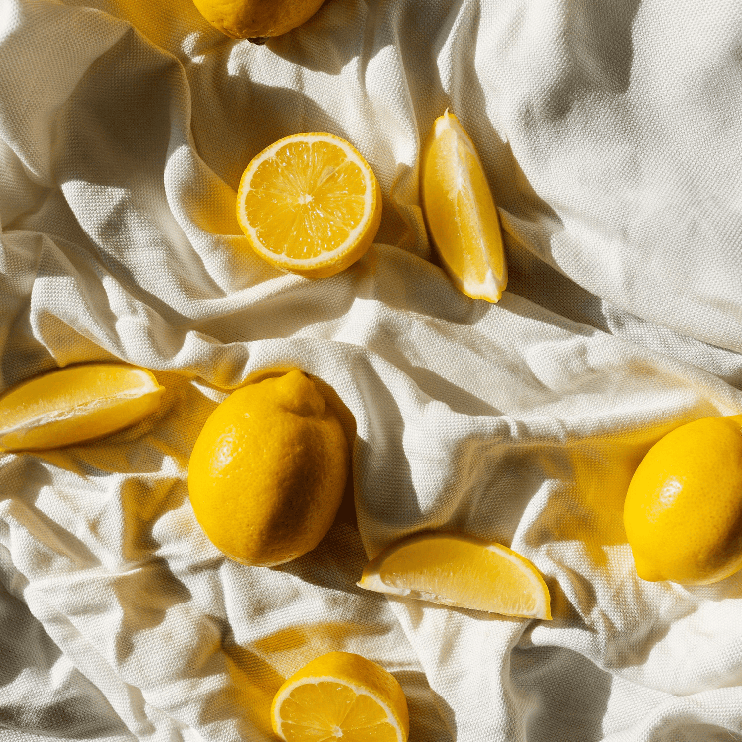 cut lemons on white cloth