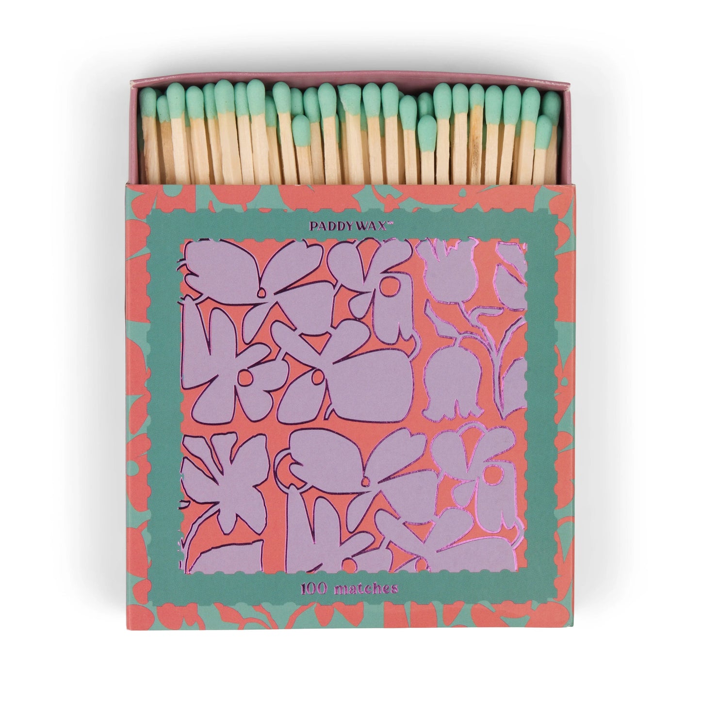 An open box of 100 green-tip matches is shown. The Jumbo Boxed Matches - Abstract Floral features a floral design in pink, purple, and green with the Paddywax brand on the front.
