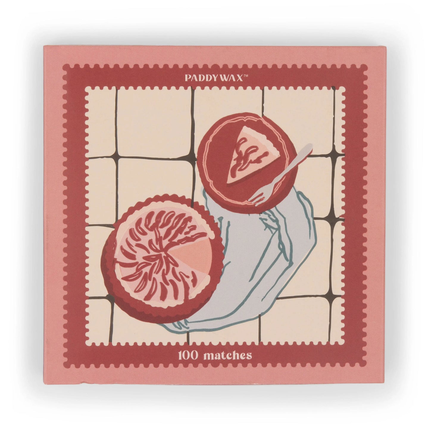 A pink Jumbo Boxed Matches - Picnic & Pie features a hand holding a plate with grapefruit slices—perfect for lighting your favorite Paddywax candle.