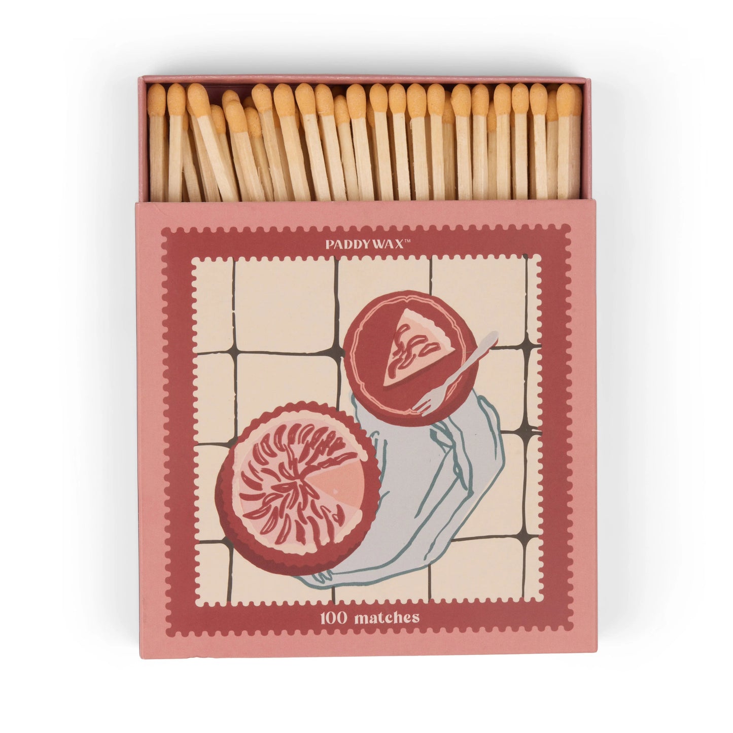 The Jumbo Boxed Matches - Picnic & Pie is a pink matchbox labeled “100 matches,” featuring wooden matches and an illustration of two grapefruits on a tiled background.