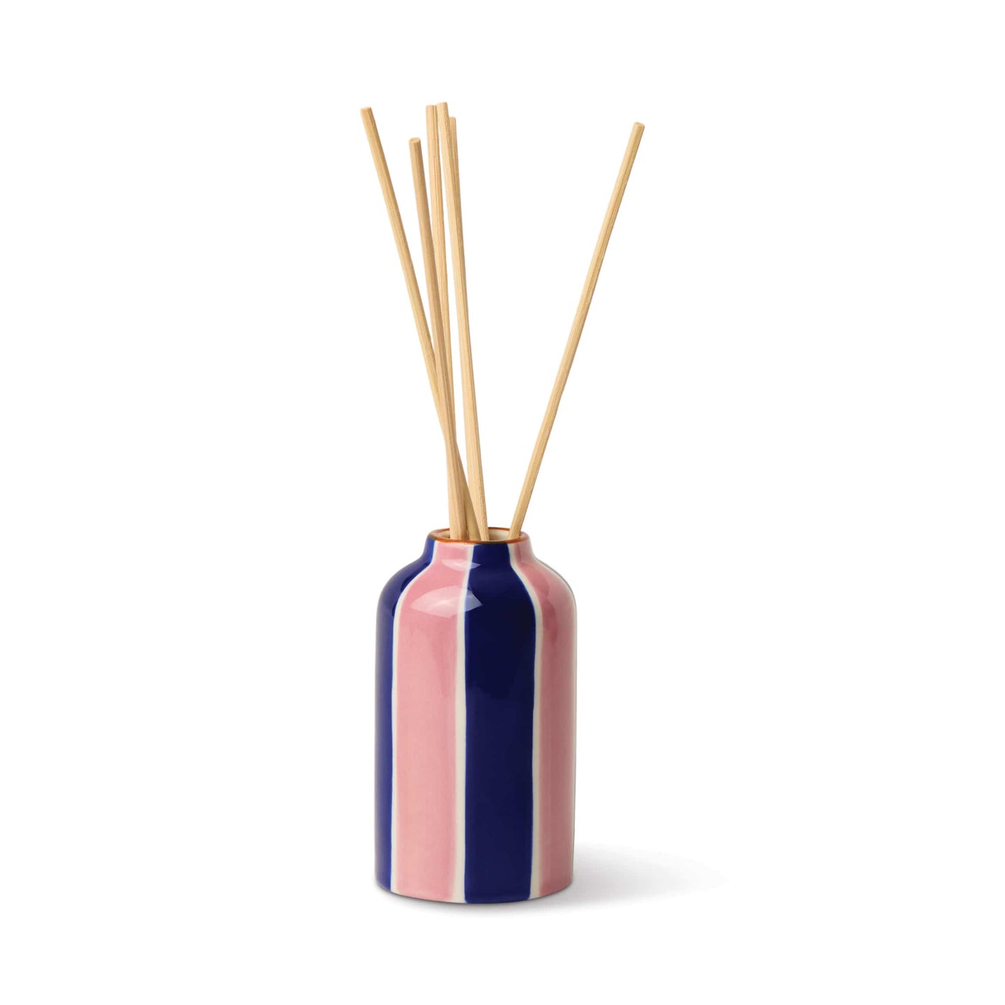 The Rosewood Vanilla - A Dopo 4 oz Diffuser features a ceramic bottle with vertical pink and dark blue stripes, complemented by several long wooden reeds, all set against a plain white background.