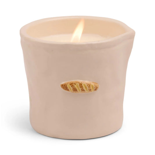 The Bistro Candle - Baguette features a beige ceramic holder with a small bread loaf decoration—an aromatic candle inspired by culinary culture, perfect for adding charm to your space.