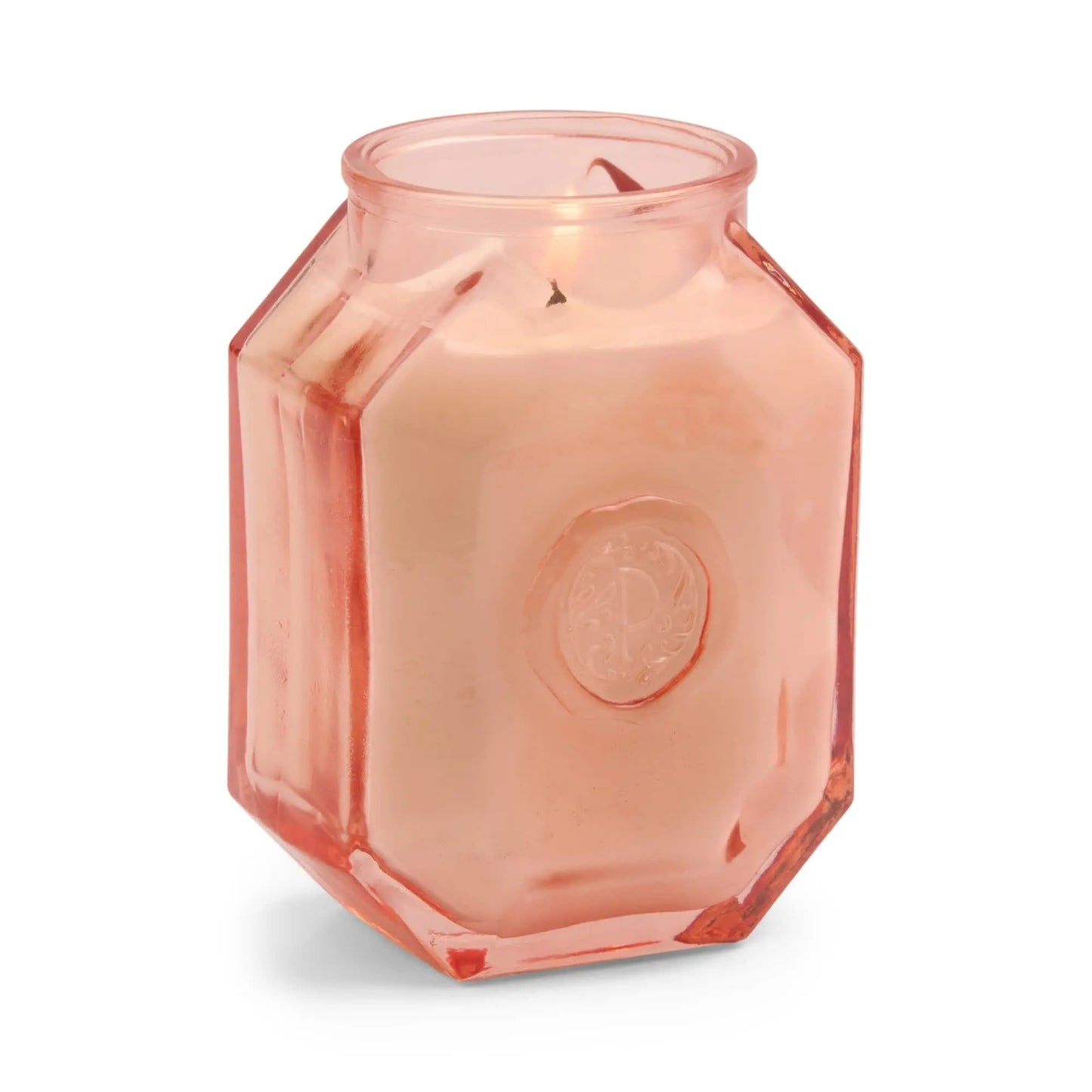 Introducing the Botanica Candle - Saffron Rose: a pink hexagonal glass jar from the Luxurious Botanica Collection, featuring a wax candle inside and an embossed circular design—ideal for pairing with your favorite candles or diffusers.