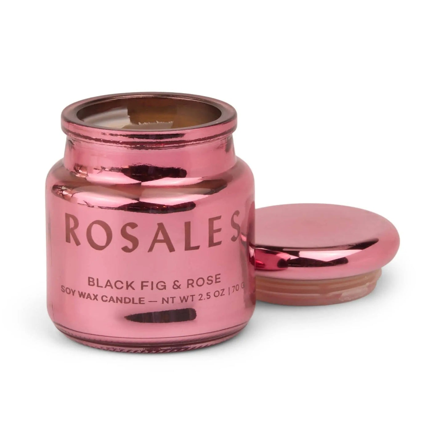 A pink metallic jar from the Chroma collection, the Chroma Candle - Saffron Rose, with its electroplated glass lid off and placed beside it for a unique scent experience.