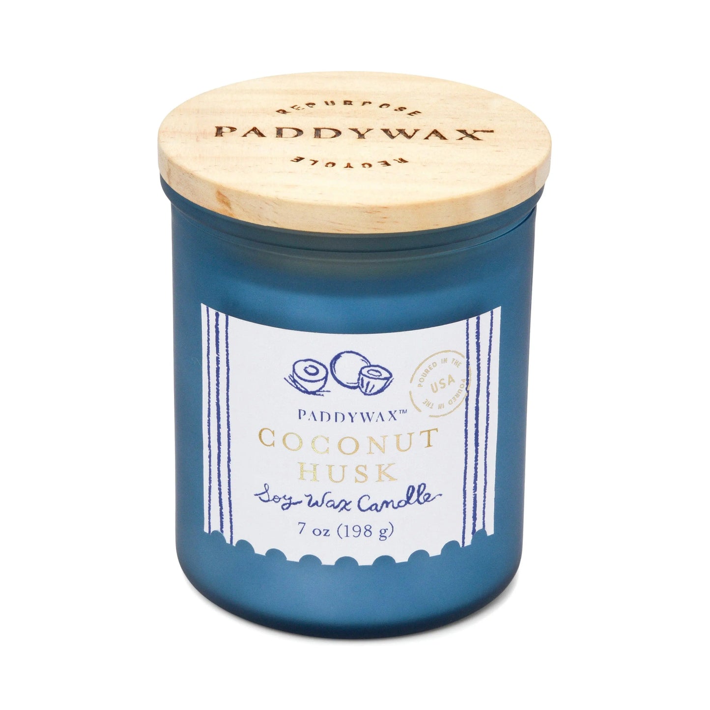 The Coastal 7oz Candle - Coconut Husk features a blue glass jar with a wooden lid, inspired by sea glass and fresh coastal breezes, and is part of Paddywaxs Coastal Candle Collection.