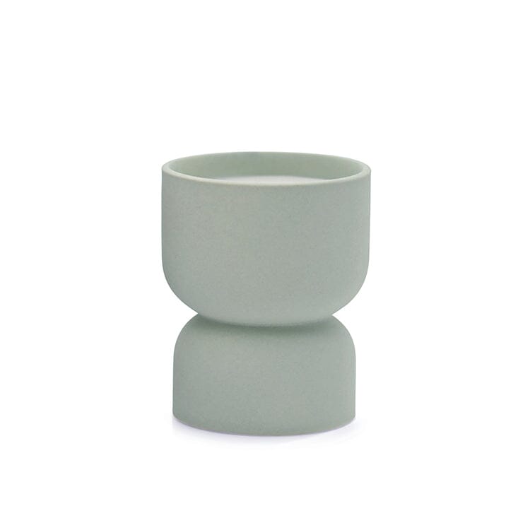 The Form 6oz. Mint Matte Hourglass Ceramic Ocean Rose & Bay cup features a light green matte finish, a double-bowl hourglass design, and symmetrical shape—shown here as a unique vessel on a white background.