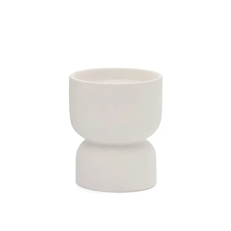 The Form 6oz. - White Matte Hourglass Ceramic Tobacco Flower features a geometric white ceramic cup, perfect as a stylish modern vessel or planter candle to add an elegant look and fragrance to any space.