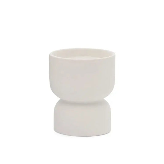 The Form 6oz. - White Matte Hourglass Ceramic Tobacco Flower features a geometric white ceramic cup, perfect as a stylish modern vessel or planter candle to add an elegant look and fragrance to any space.