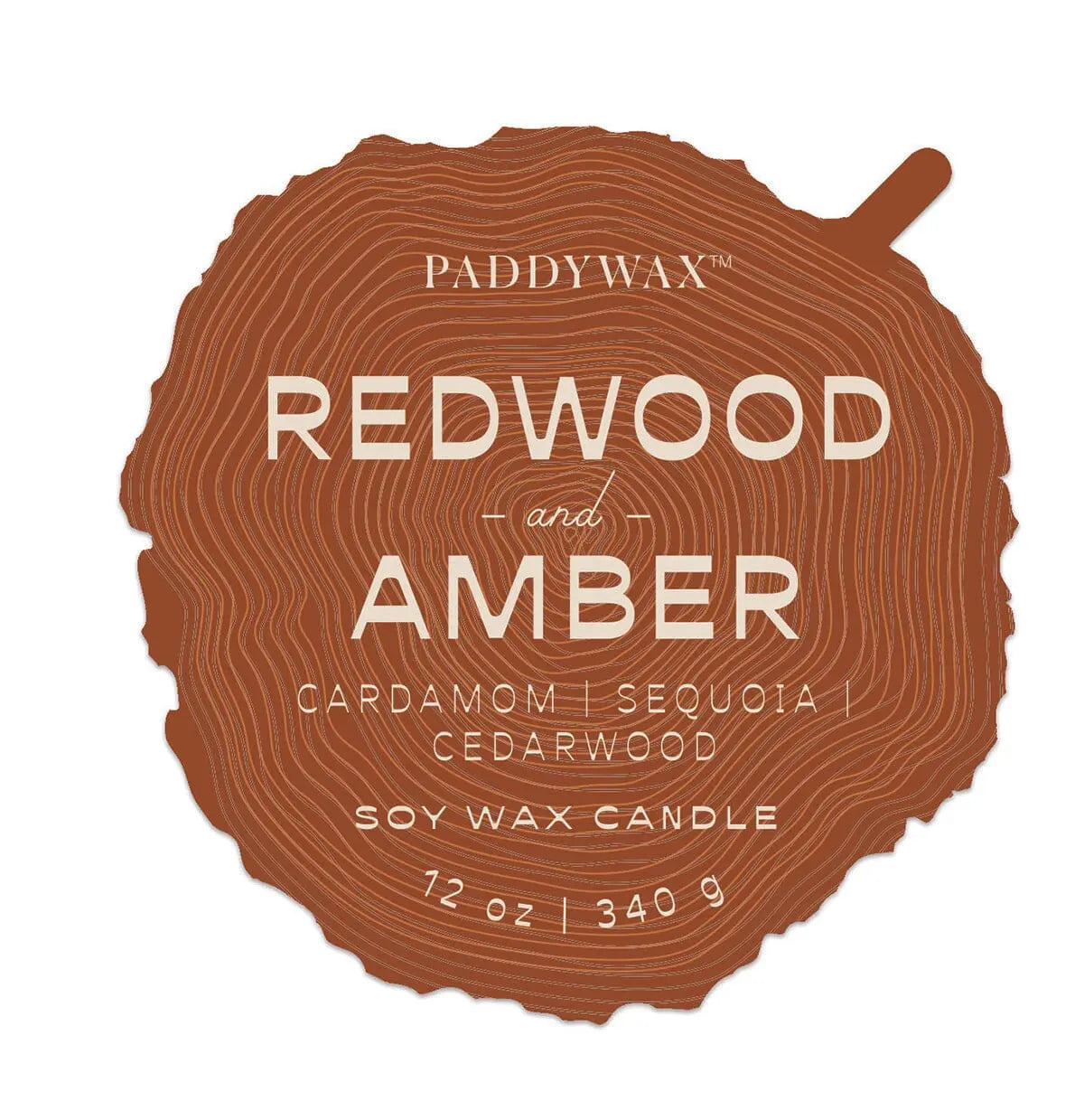 A tree ring-shaped label for the Grain Candle - Redwood & Amber, a 12 oz soy wax candle with cardamom, sequoia, and cedarwood scents—part of the Woodgrain ceramic two-wick collection.