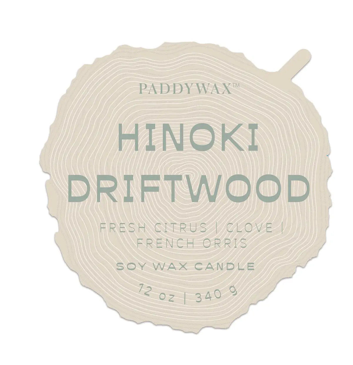 Label for Grain Candle - Hinoki Driftwood, a 12 oz (340 g) soy wax candle from Paddywaxs Woodgrain Collection. Shaped like a wood slice, it features notes of fresh citrus, clove, and French orris.
