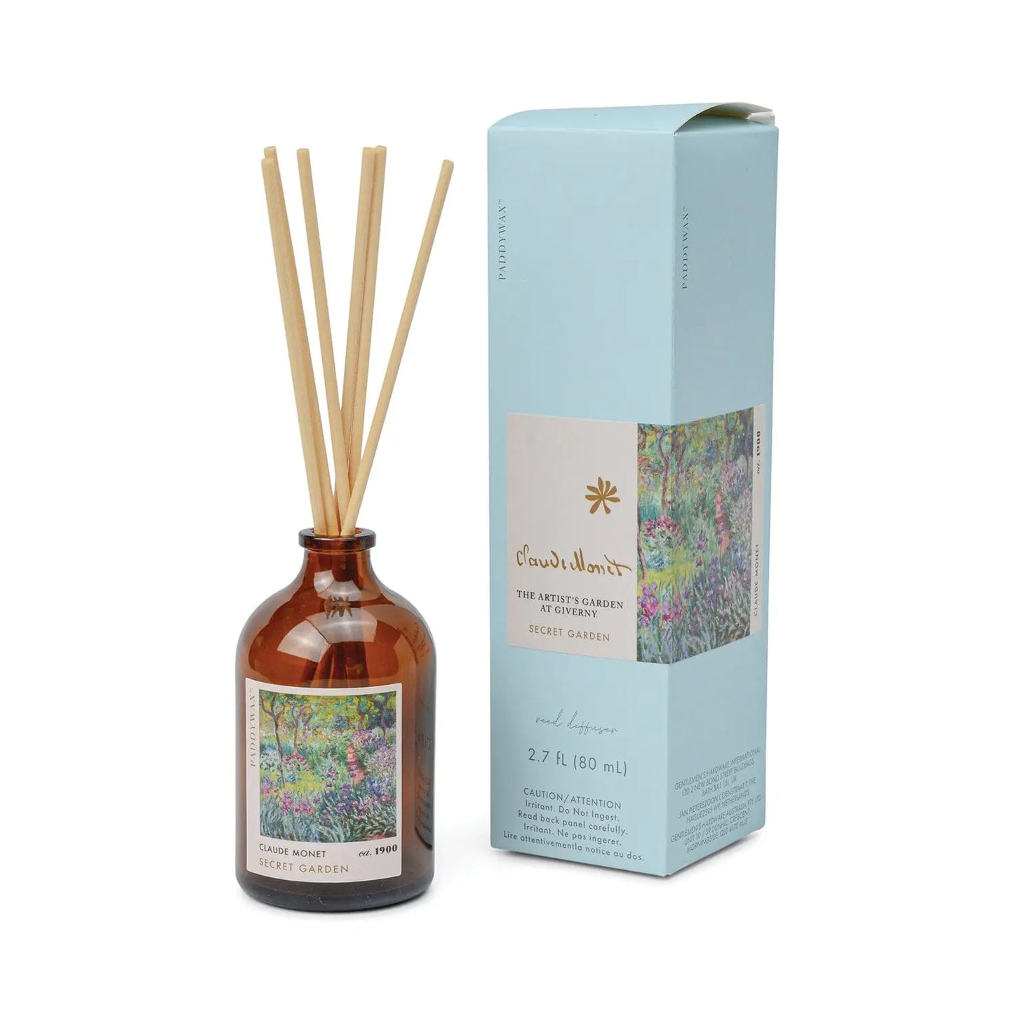The Impressionist Diffuser - Claude Monet Secret Garden features a brown glass bottle with reeds and comes in a floral blue box inspired by Monet’s artwork.