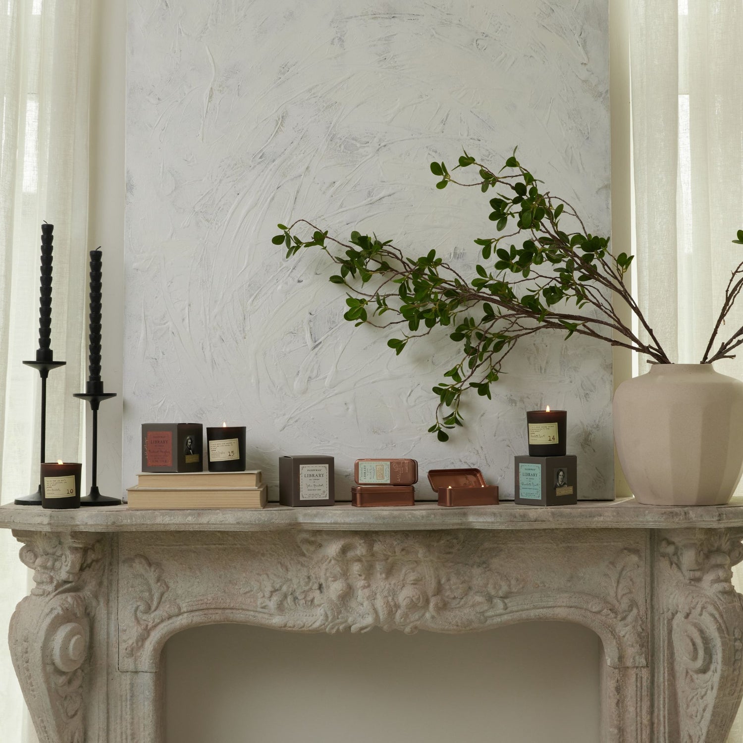 Library Candle Collection on a Mantle with books and plant