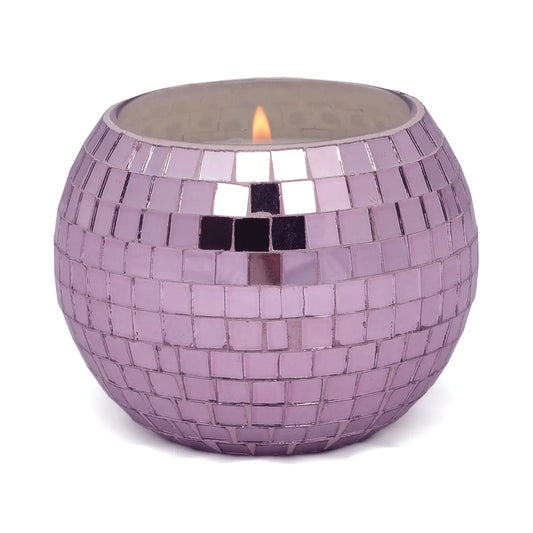 The Magique Green Disco Ball - Lavender Fern is a lit candle in a round, purple mosaic glass holder with a reflective tiled pattern—perfect as a handcrafted mirror ball candle to elevate your home decor.