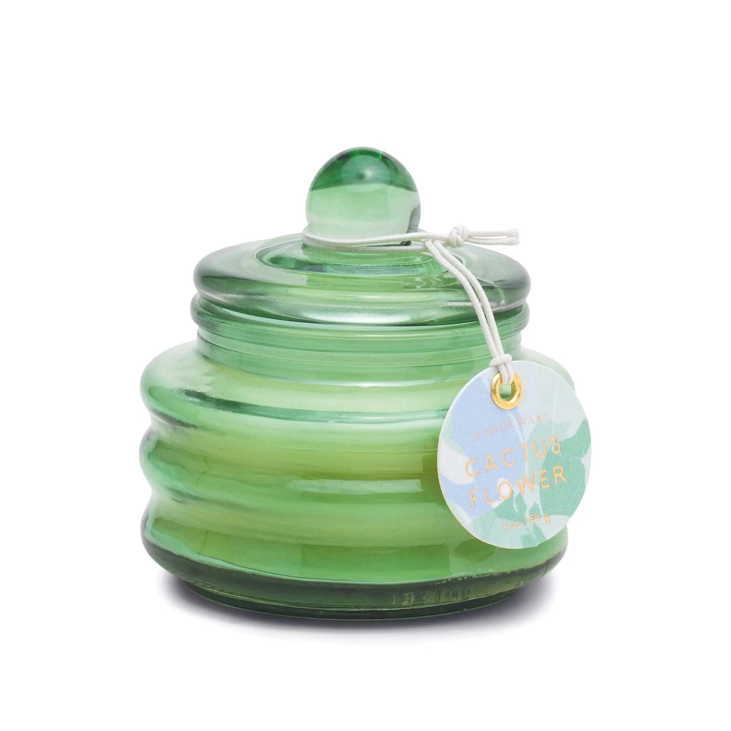 A green ribbed glass jar with a rounded lid and white string tag labeled “Cactus Flower,” the 3oz Beam candle evokes a fresh spring scent—ideal for gifting or as a unique jewelry box after use.