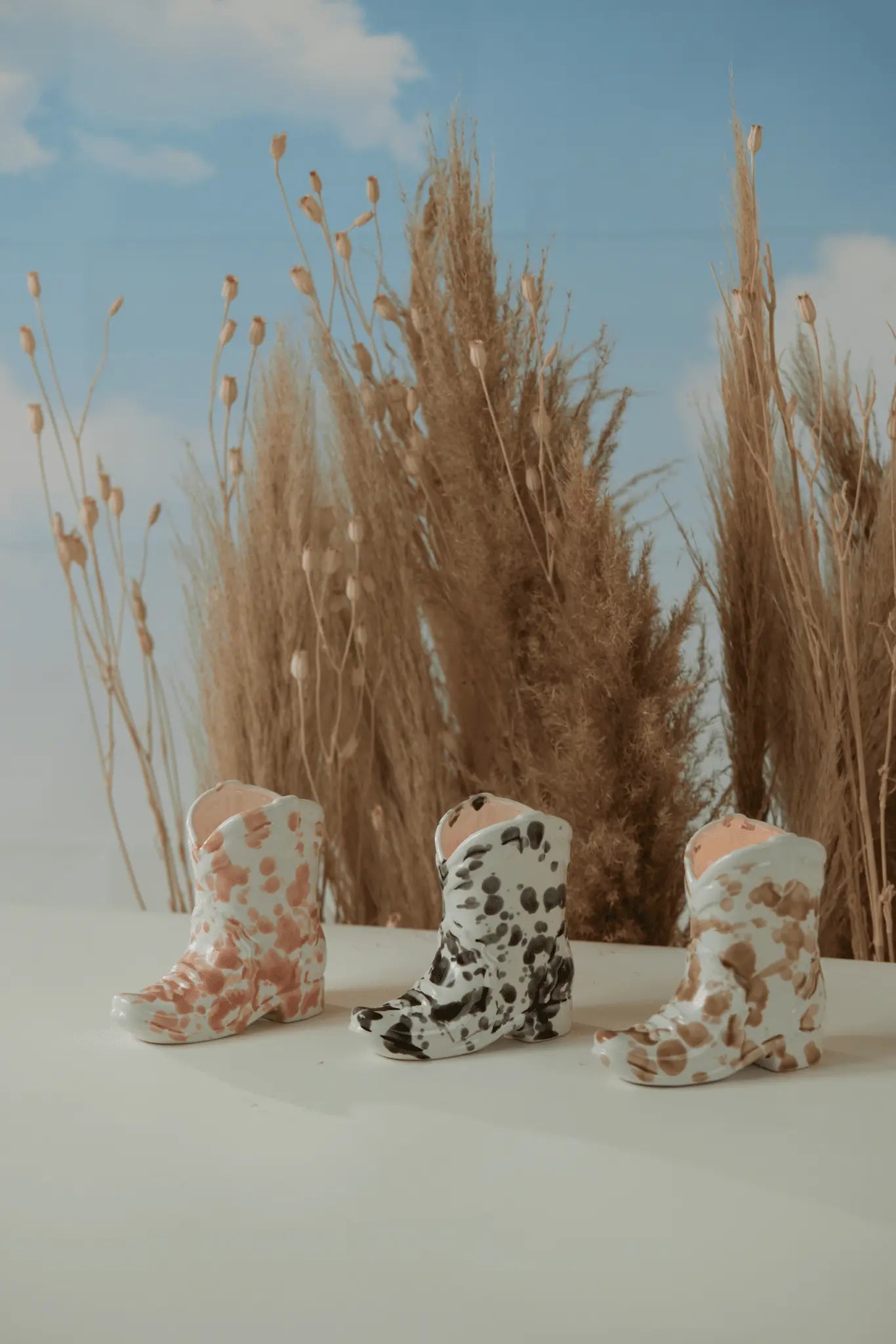 Three cowboy boot candles.