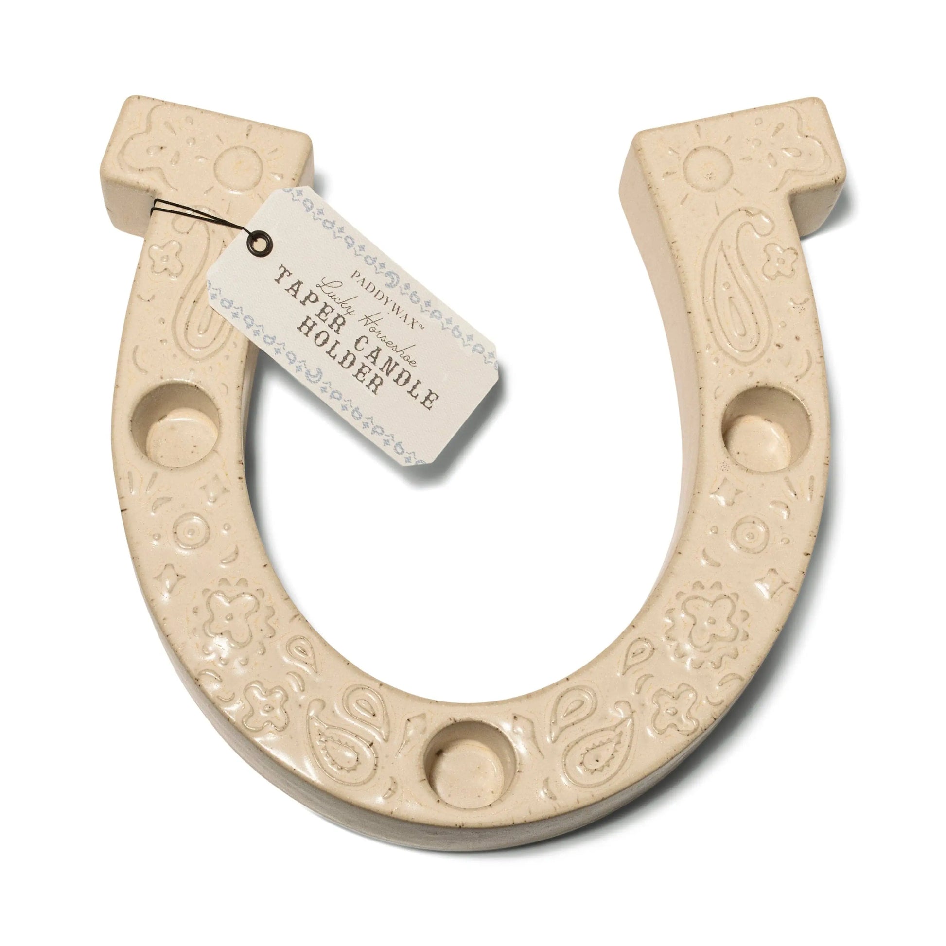 The Nashville White Ceramic Horseshoe Taper Holder w/ Hangtag features decorative patterns and a tag labeled TABLE CANDLE HOLDER, adding charm to your home decor.