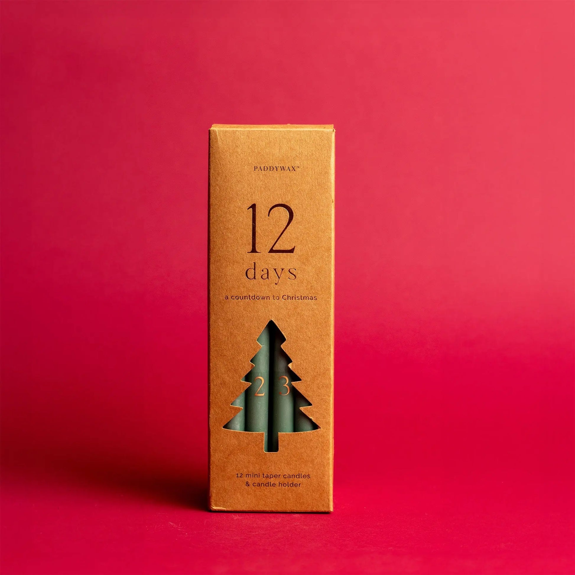 Cypress + Fir Taper 12 Days of Christmas Countdown Candle Set on red background