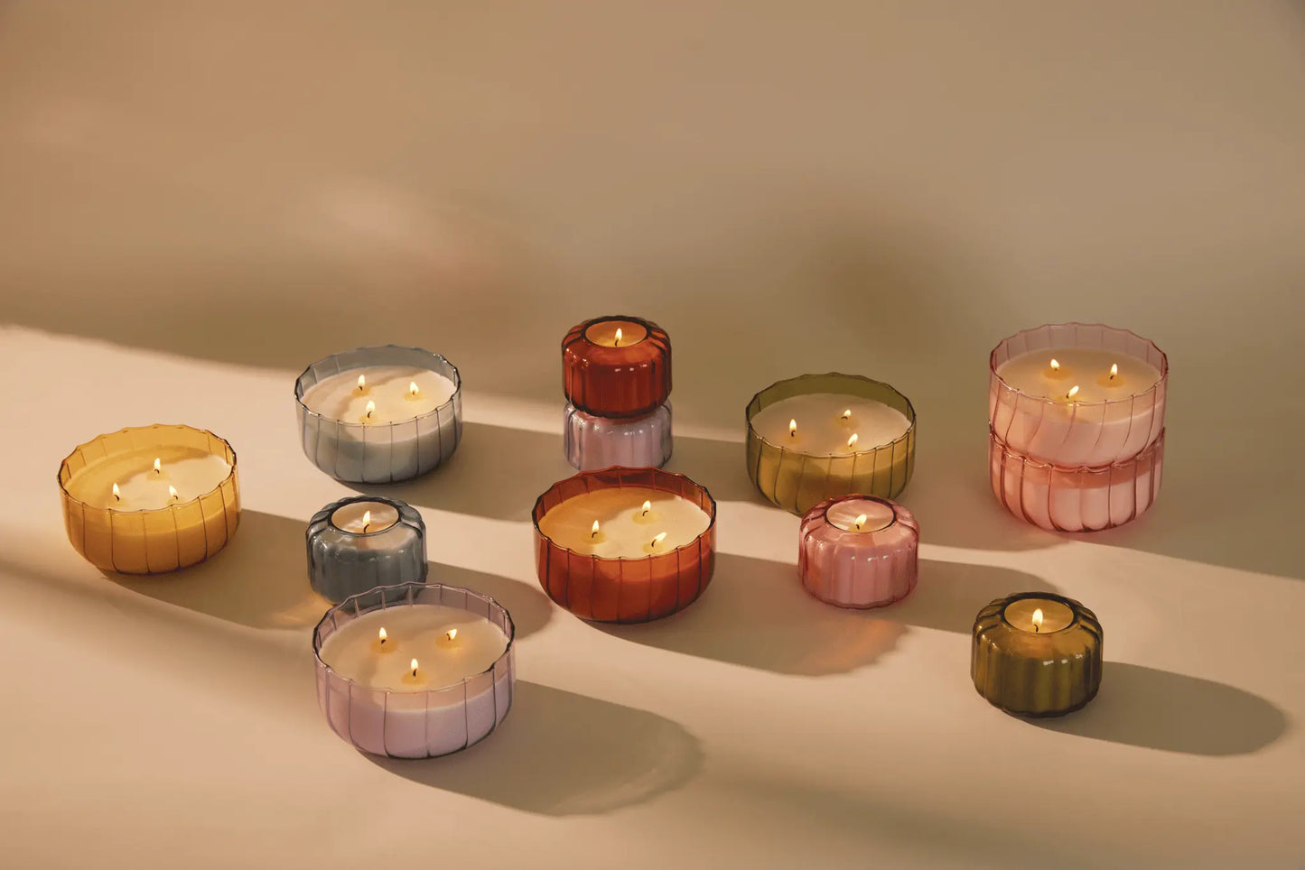 Candles from the Ripple collection on a white background.