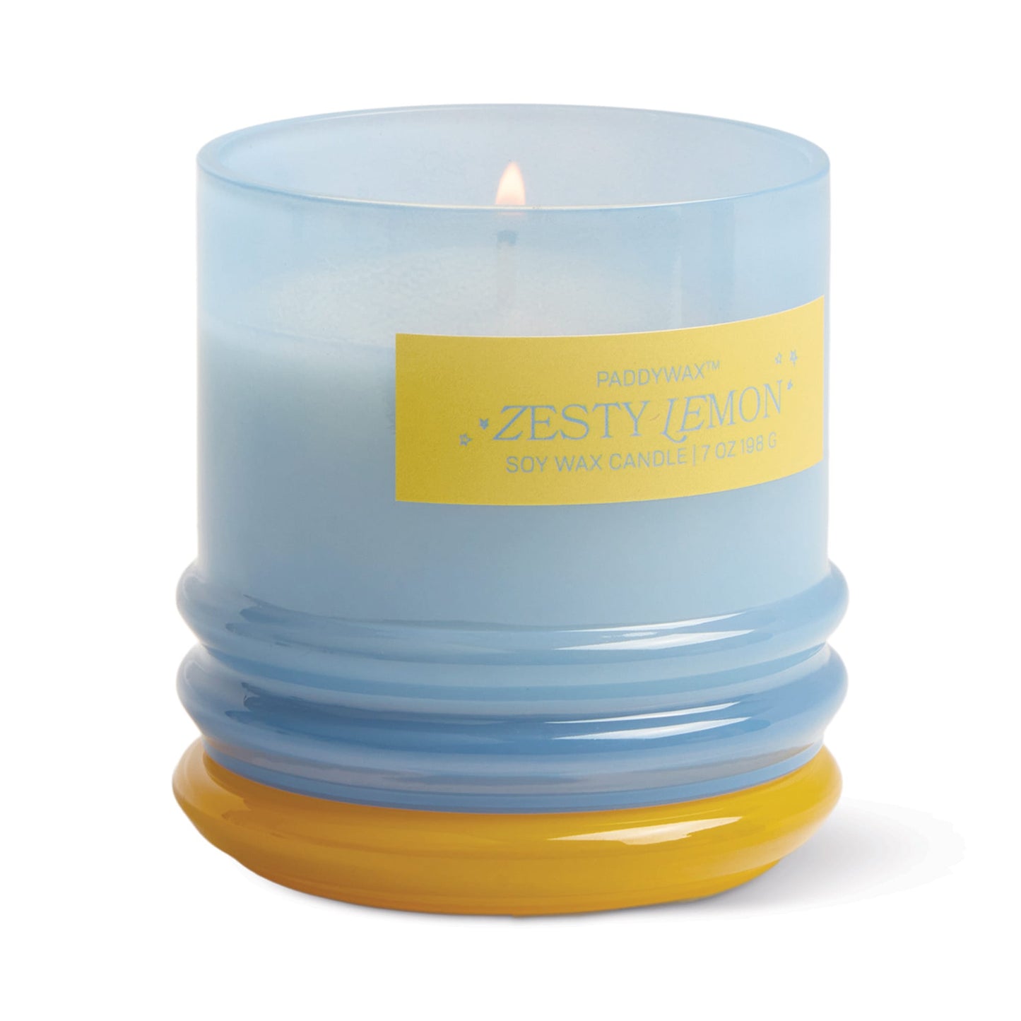 The Zesty Lemon - Stack 7 oz Candle features a citrus scent and comes in a light blue reusable glass vessel with a yellow label and base, revealing wax when lit for lasting style and fragrance.