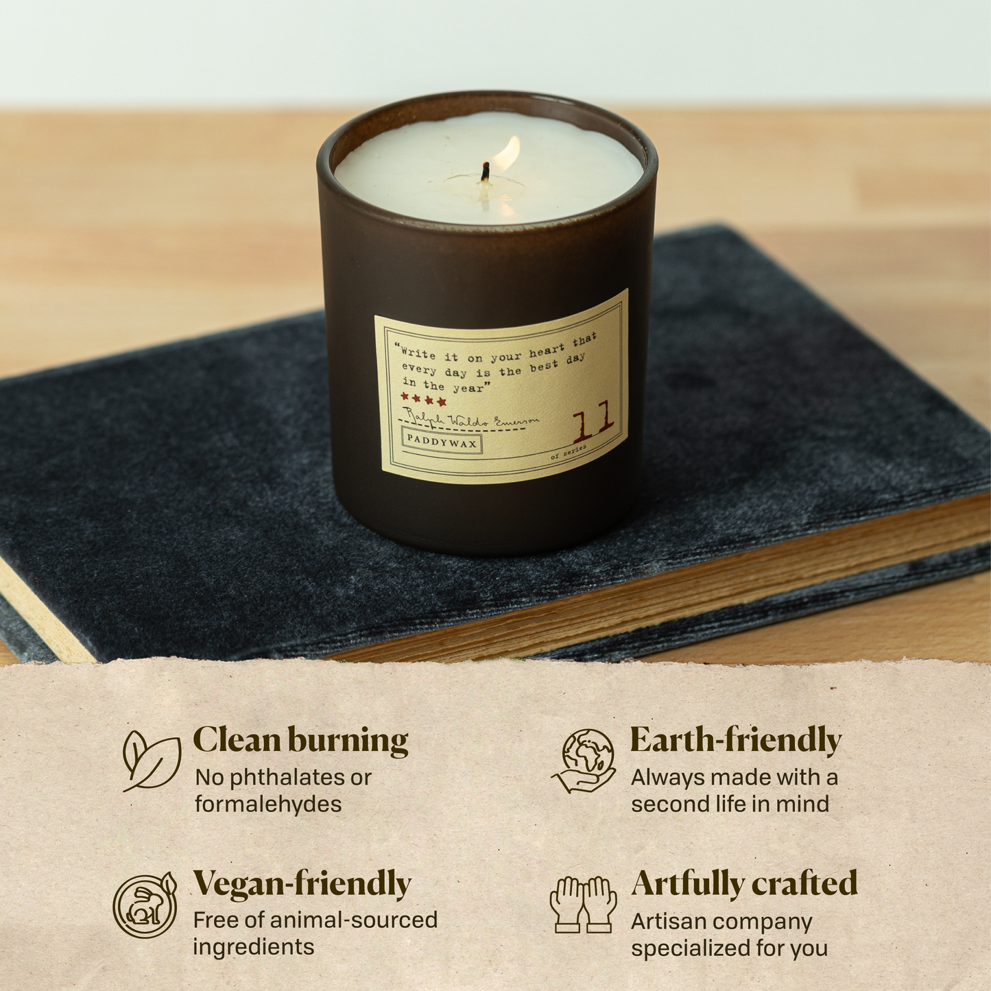 A photo of the Ralph Waldo Emerson candle sitting on a book. Clean burning: no phthalates or formaldehydes. Earth-friendly: Always made with a second life in mind. Vegan-friendly: Free of animal sourced ingredients. Artfully crafted: Artisan company specialized for you.