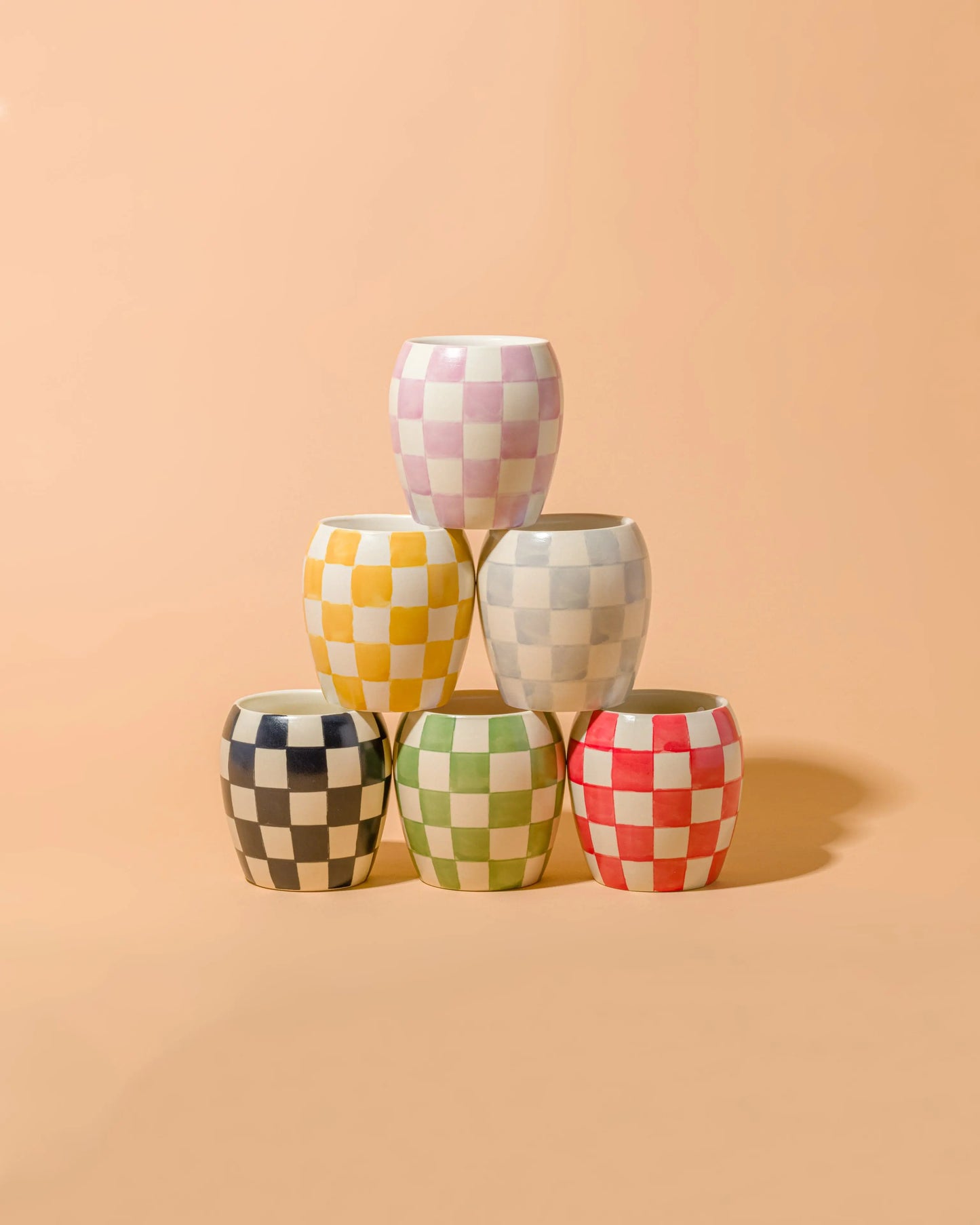 Checkmate candles stacked in a pyramid shape.