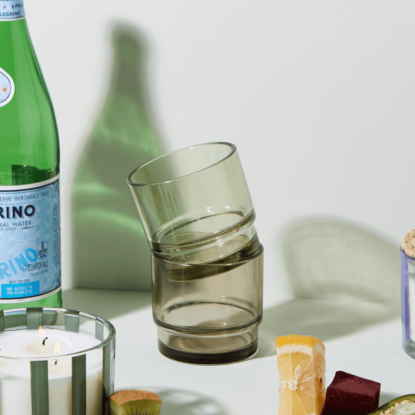 7 oz green-tinted glass vessels being repurposed as cups, and stacked on top of one another