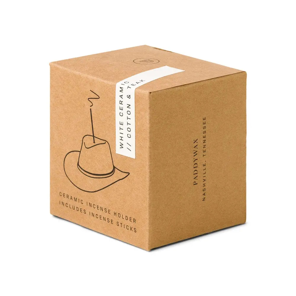 brown box packaging with outline of the ceramic cowboy hat holding an incense stick