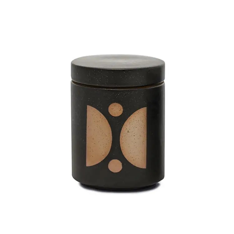 12 oz black cylindrical ceramic vessel with ceramic lid; white wax and two cotton wicks; reflected beige semi-circle design on the side