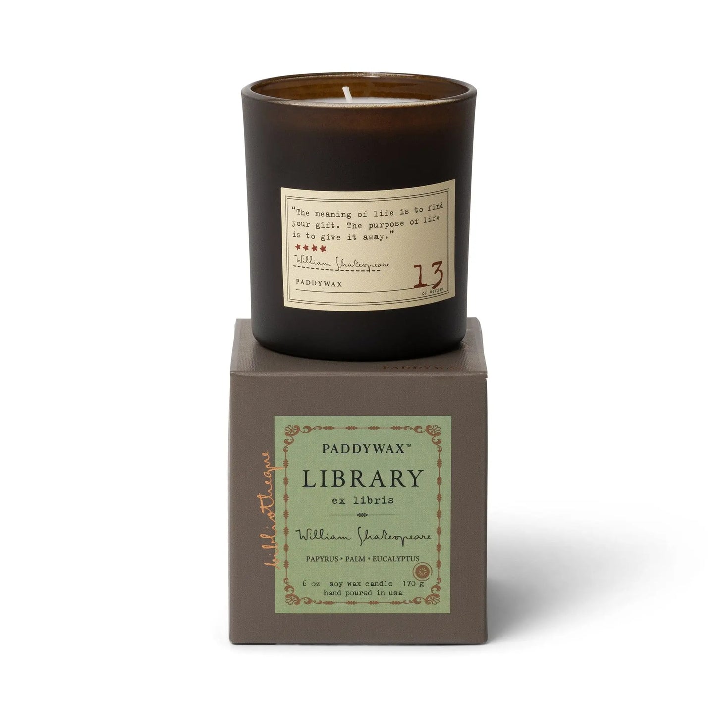The Library 6 oz Candle - William Shakespeare features papyrus, palm, and eucalyptus scents in a dark glass jar with a Shakespeare quote, beautifully boxed as part of the Paddywax Library Collection.