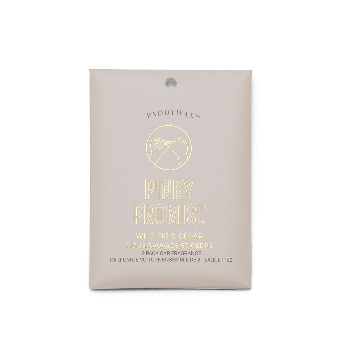 A beige packet labeled Impressions Car Fragrance - Wild Fig + Cedar Pinky Promise features a hand-outline design and delivers the wild fig & cedar scent.