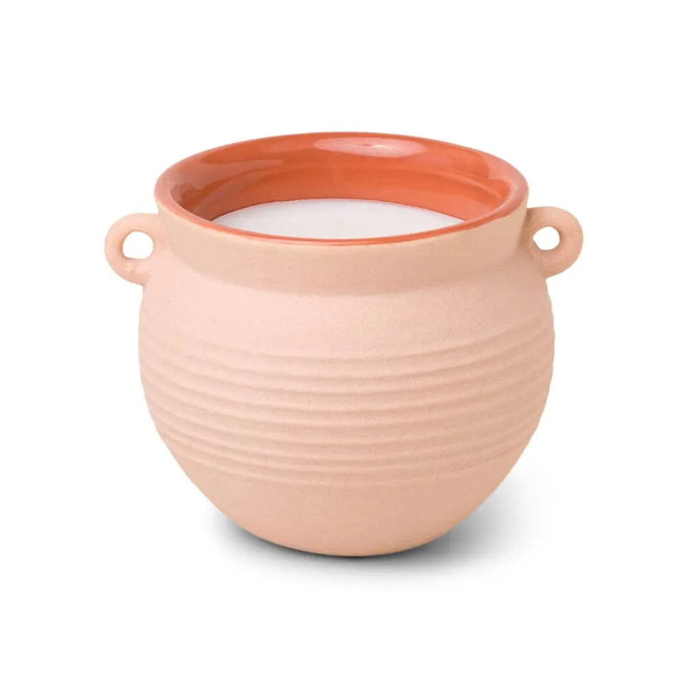 The Santorini 8.5 oz. Candle - Black Fig & Olive comes in a round, beige ceramic holder with side handles and a glossy terracotta rim, inspired by the Santorini collection.