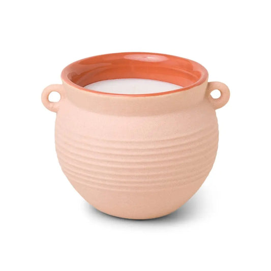 The Santorini 8.5 oz. Candle - Black Fig & Olive comes in a round, beige ceramic holder with side handles and a glossy terracotta rim, inspired by the Santorini collection.