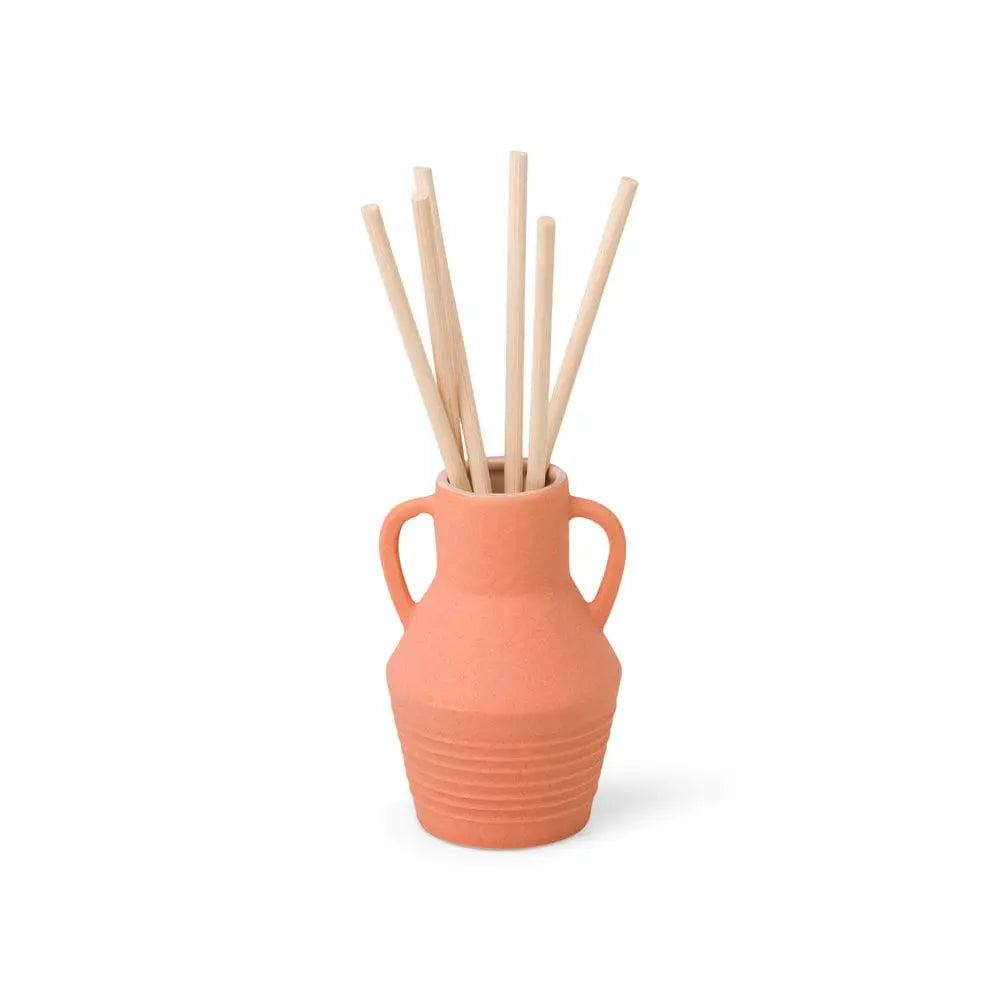 The Santorini 4 fl oz. Diffuser - Raw Clay & Pear features a terracotta ceramic vase with two handles and light wooden sticks, creating a stylish fragrance accent against a plain white background.