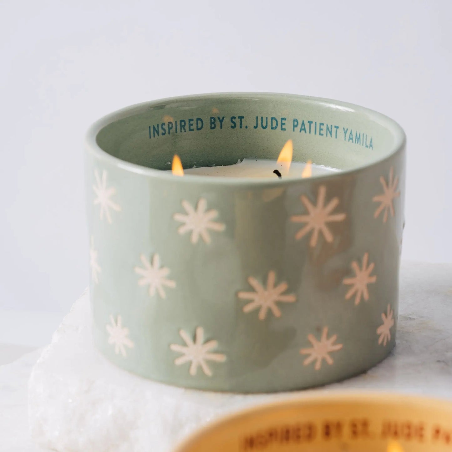 St. Jude green ceramic candle burning