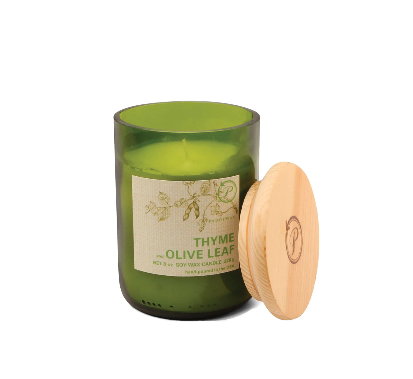 Candle in an 8 oz green glass vessel with a beige label and a wooden lid