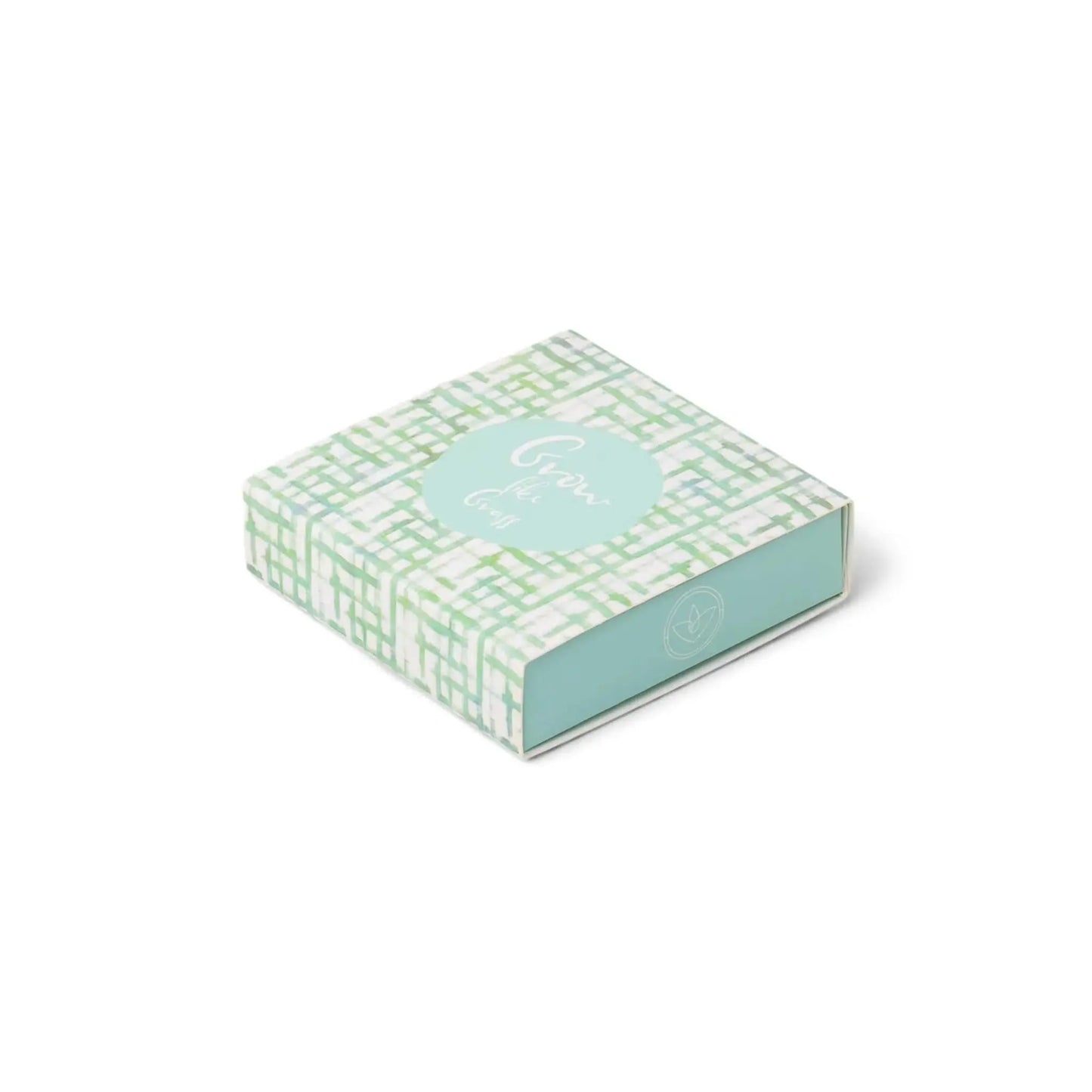 The Terrace Matches - Grow Like Grass come in a square mint green and white patterned box with a “Grow the Good” label, ideal for stylishly storing your matches. Shown here on a plain white background.