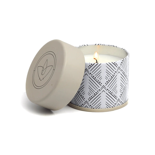 The Terrace 5oz Candle - Vintage Tweed & Oak comes in a white round container with black geometric patterns and a beige lid featuring a circular logo—an eye-catching addition to your candle collection.