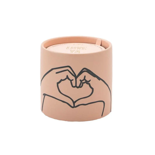Impressions 5.75 oz Candle - Tobacco + Vanilla "Love Ya" - light pink colored vessel with a black outline hand making a heart