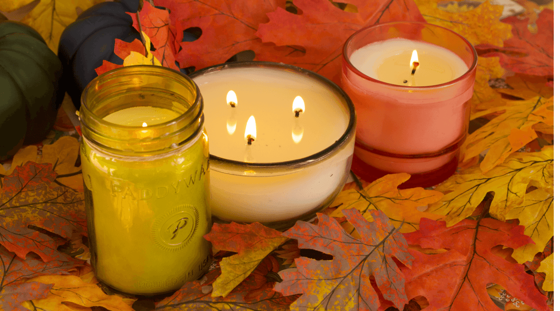 3 vanilla scented candles on leaf background