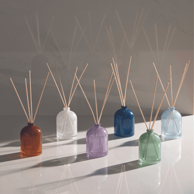 Petite Reed diffusers on reflective surface