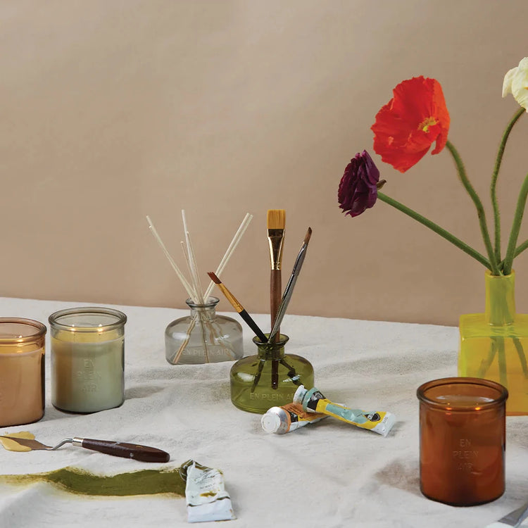 En Plein Air collection.  With paint, flower vases, and table