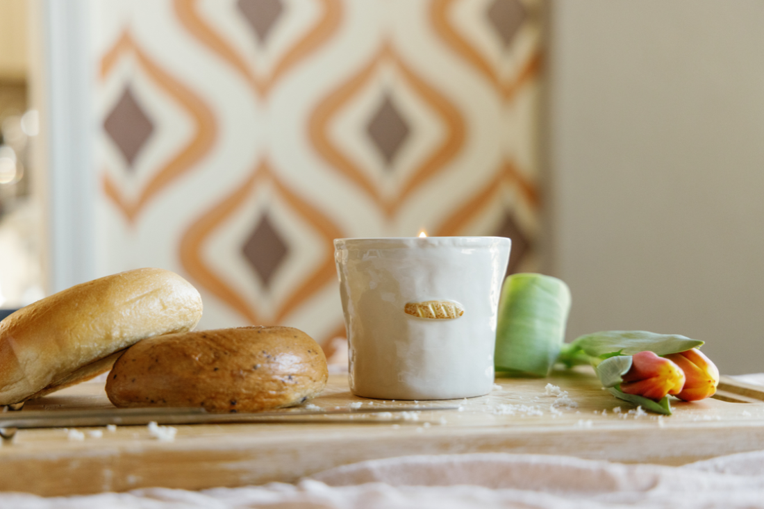 Candle with rosemary and cotton sprigs