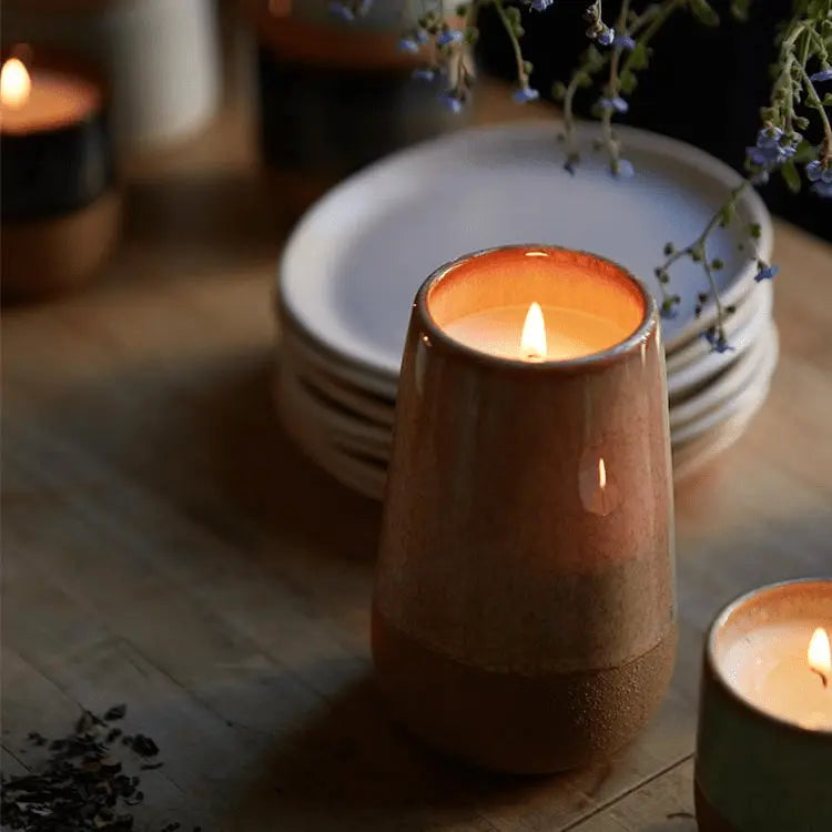 Kin 10 oz candle on table top