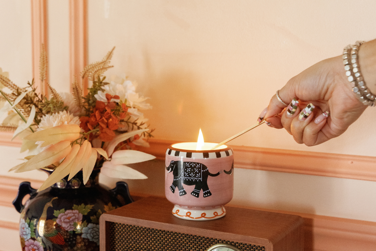 Candle arranged with lemon and orange slice 