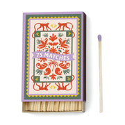 A Dopo Jungle - 75ct Boxed Matches features a decorative box with red monkeys and floral designs, plus purple-tipped safety matches—perfect for lighting your A Dopo candle after Mediterranean travels.