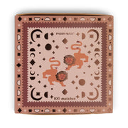 The Lions - Orange Matches box features two stylized lions with geometric shapes and brown patterns on a light pink background. This square matchbox candle accessory contains 100 jumbo matches.