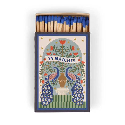 The A Dopo "Peacock" - 75ct Boxed Matches feature blue-tipped matches in a box with two peacocks and a floral tree, perfect for lighting your favorite A Dopo candle.