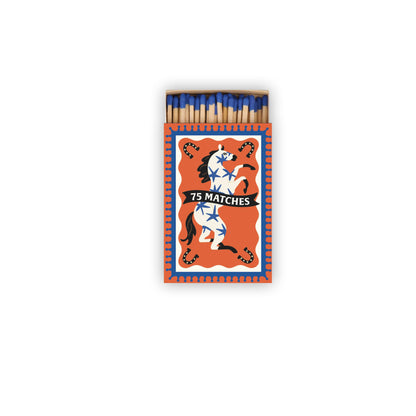 The A Dopo "Horse" - 75ct Boxed Matches feature blue-tipped heads in an open box with an orange cover, a white horse illustration, and "75 MATCHES" text—ideal for lighting your favorite A Dopo candle.