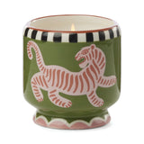 The Black Cedar & Fig - A Dopo 8 oz Candle is a hand-painted candle in a green ceramic holder with a pink tiger and black and white striped rim—perfect for enjoying unique ceramic candles.
