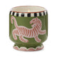 The A Dopo Tiger Candle – Black Cedar & Fig features bold fragrances in a green ceramic holder with a pink tiger and black-and-white rim details, inspired by the Mediterranean.